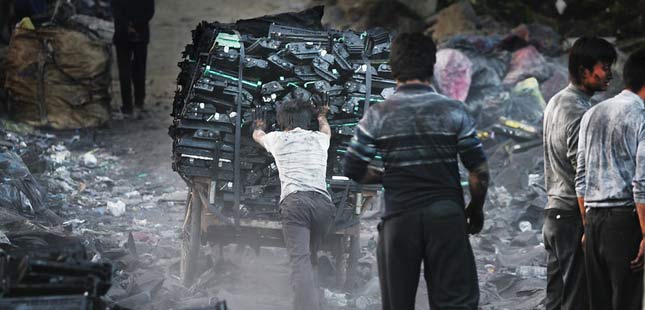 e-waste being gathered up by children